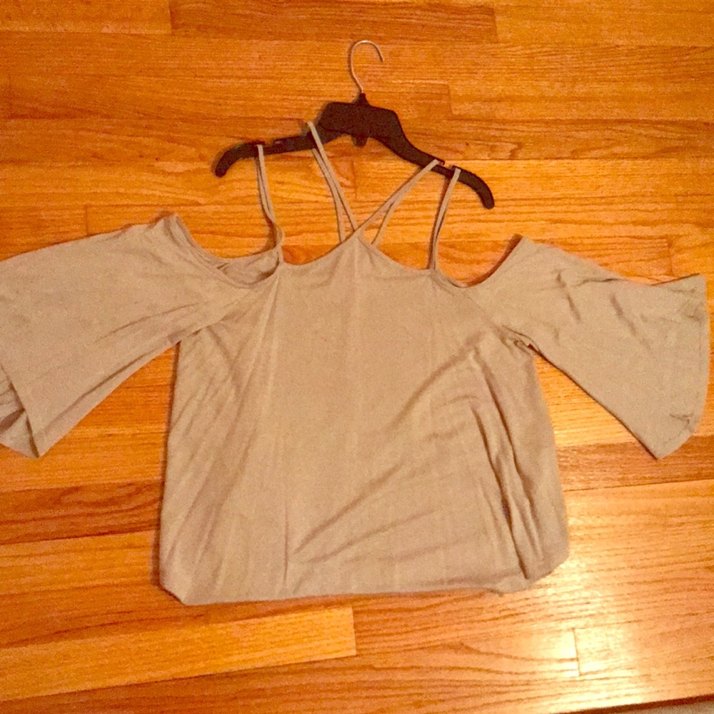 Tan top. Cut out neck and shoulders.